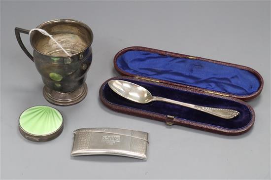 An early 20th century silver christening cup, a silver and enamel compact, silver card case and cased Victorian silver spoon.